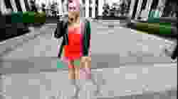 Blonde Fitness posing Super Long Legs high Heels. Red Mini Dress.